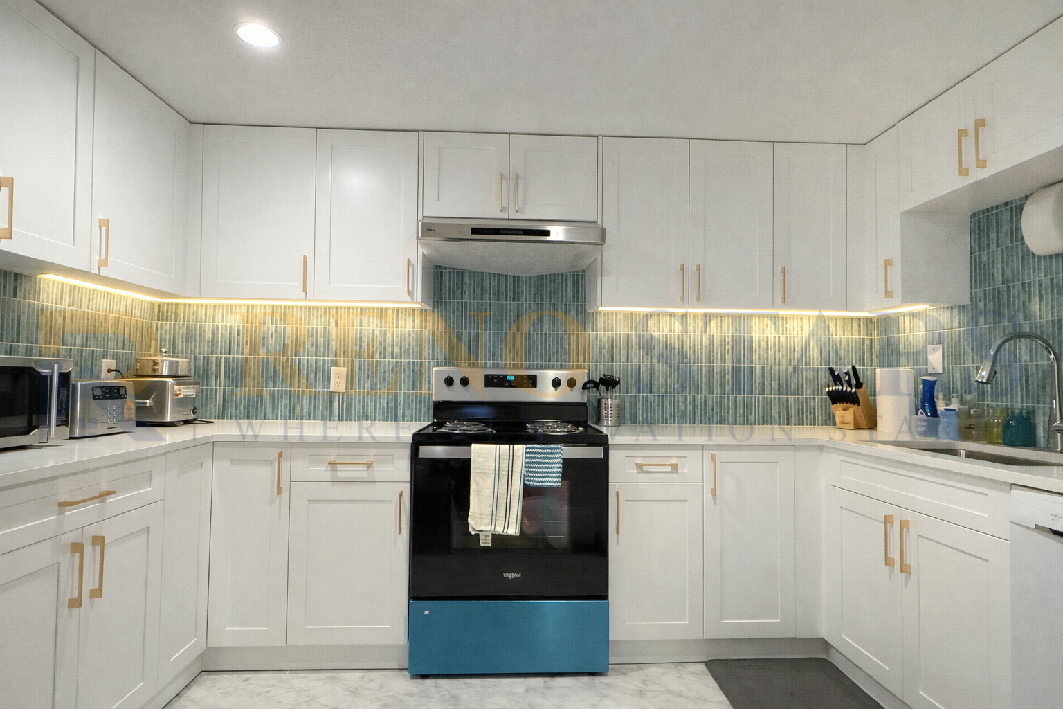 Stylish Kitchen Renovation with White Cabinets and Gold Handles